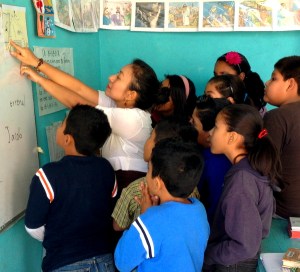 Children getting a geography lesson at Iglesia Getsemani in Morelos